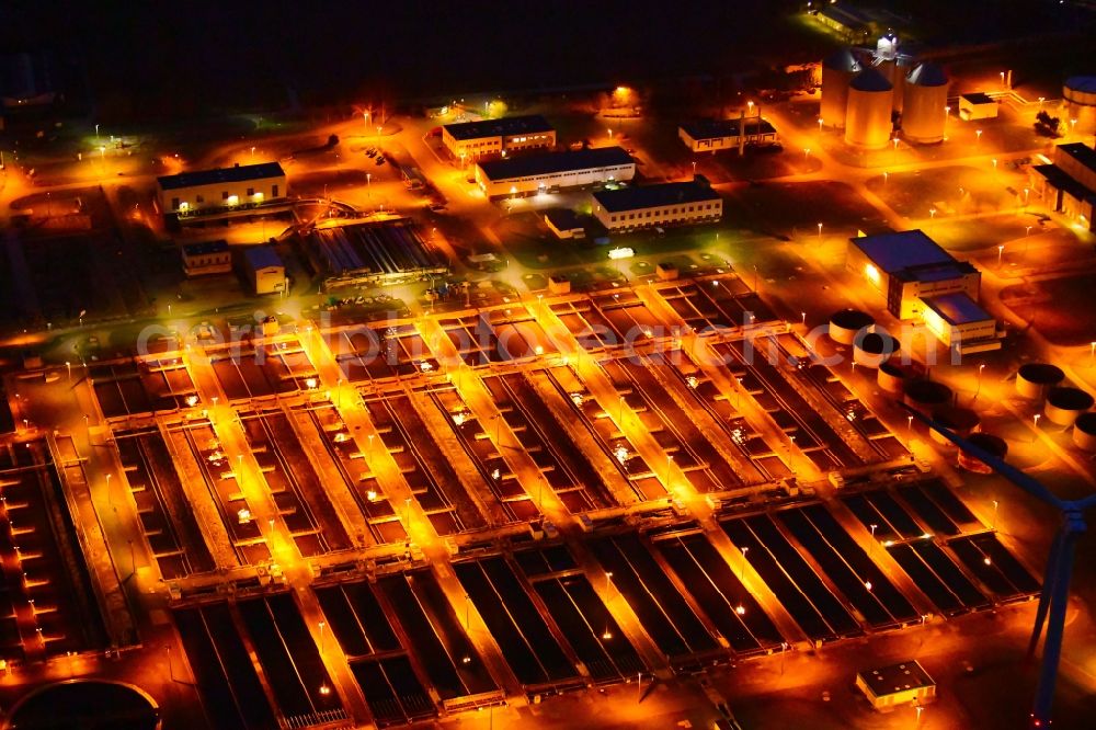 Aerial image at night Wandlitz - Night lighting sewage works Basin and purification steps for waste water treatment in Schoenerlinde in the state Brandenburg, Germany