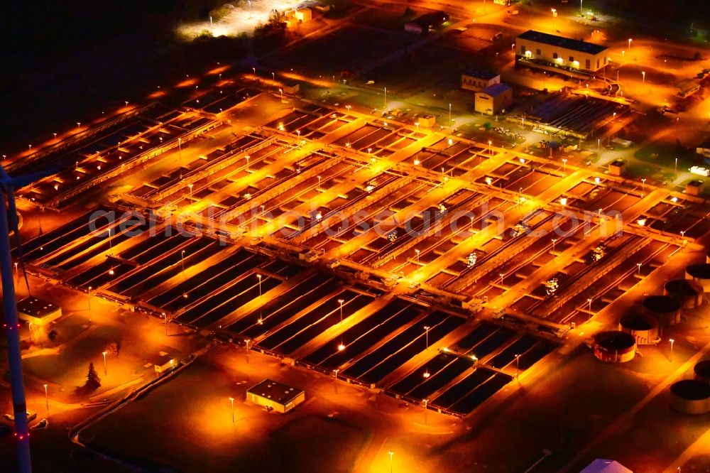 Wandlitz at night from above - Night lighting sewage works Basin and purification steps for waste water treatment in Schoenerlinde in the state Brandenburg, Germany