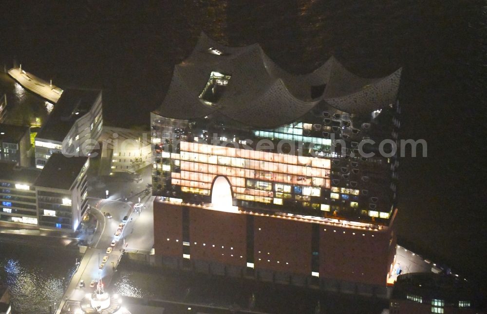 Hamburg at night from above - Night lighting The Elbe Philharmonic Hall on the river bank of the Elbe in Hamburg