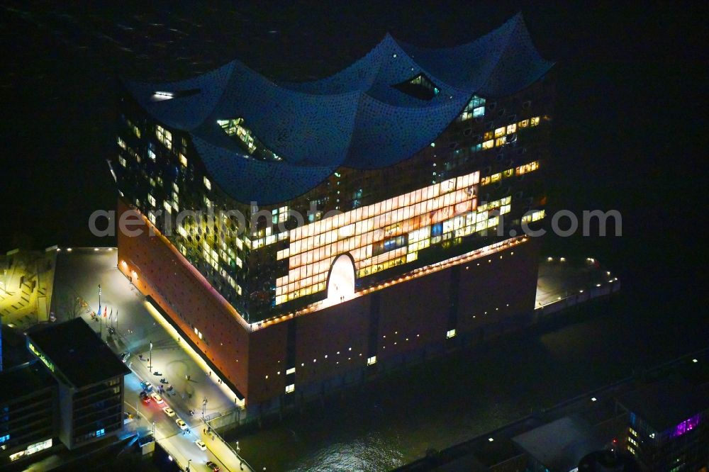 Aerial image at night Hamburg - Night lighting The Elbe Philharmonic Hall on the river bank of the Elbe in Hamburg