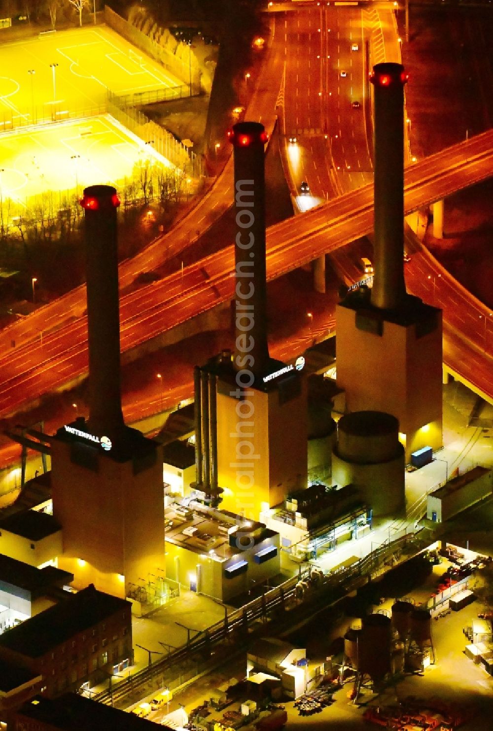 Aerial photograph at night Berlin - Night lighting power plants and exhaust towers of thermal power station Wilmersdorf on Forckenbeckstrasse in Berlin, Germany