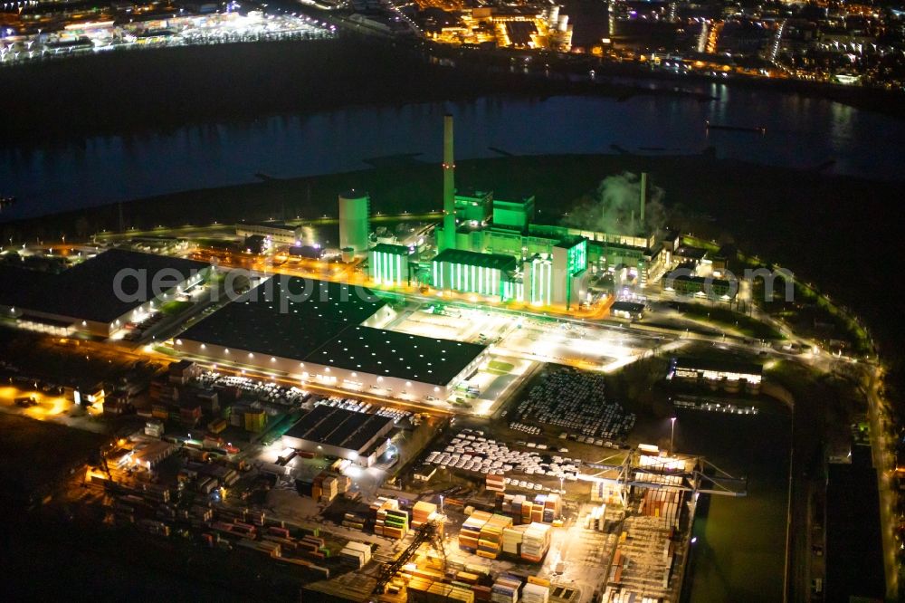 Düsseldorf at night from above - Night lighting power plants and exhaust towers of thermal power station Lausward of Stadtwerke Duesseldorf AG on rhine waterway port in Duesseldorf in the state North Rhine-Westphalia