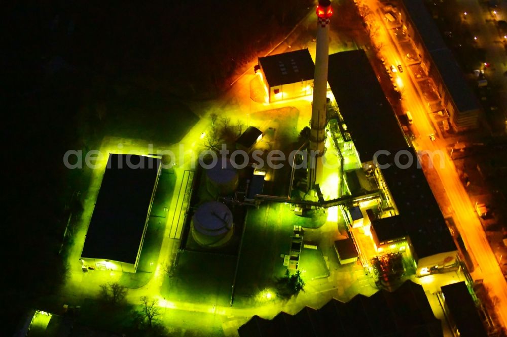 Berlin at night from above - Night lighting power plants and exhaust tower of thermal power station Vattenfall Heizkraftwerk Buch in the district Buch in Berlin, Germany