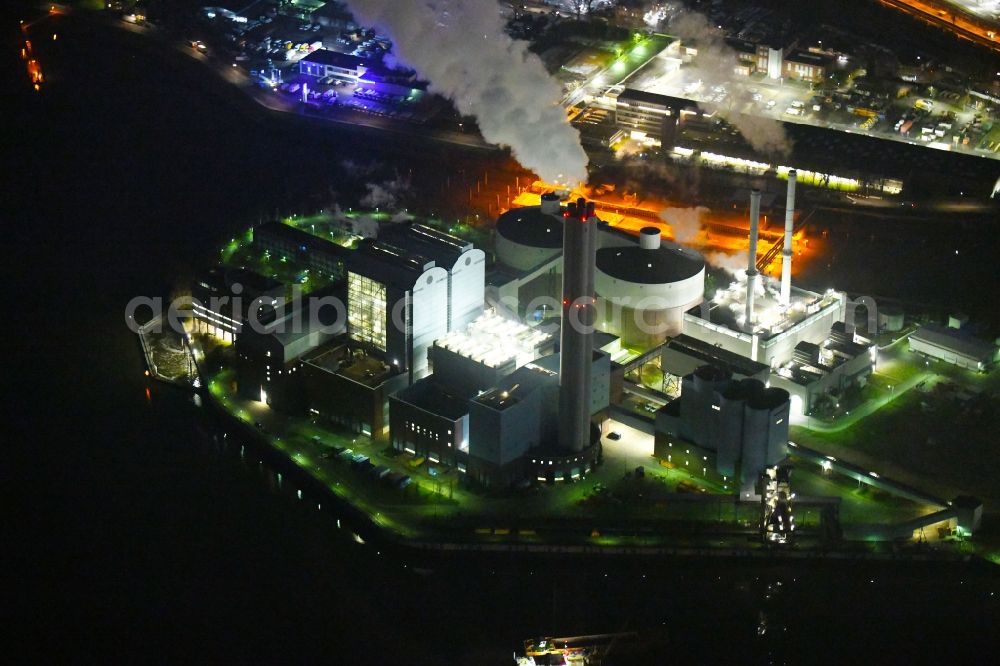 Hamburg at night from above - Night lighting power plants and exhaust towers of thermal power station Vattenfall Kraftwerk Tiefstack in Hamburg, Germany