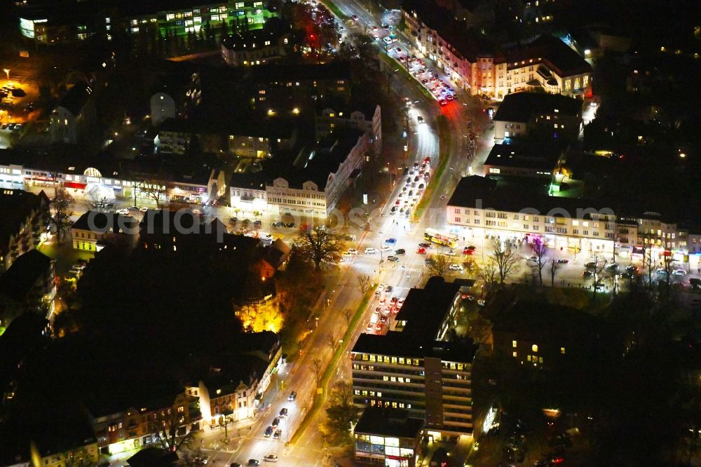 Aerial image at night Berlin - Night lighting Road over the crossroads Clayalleee - Teltower Damm - Berliner Strasse in the district Zehlendorf in Berlin, Germany