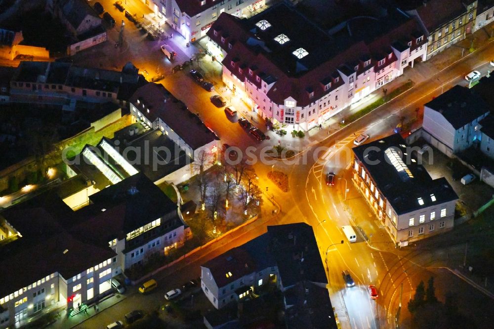 Strausberg at night from above - Night lighting Road over the crossroads Karl-Liebknecht-Strasse - Grosse Strasse - Wallstrasse in Strausberg in the state Brandenburg, Germany