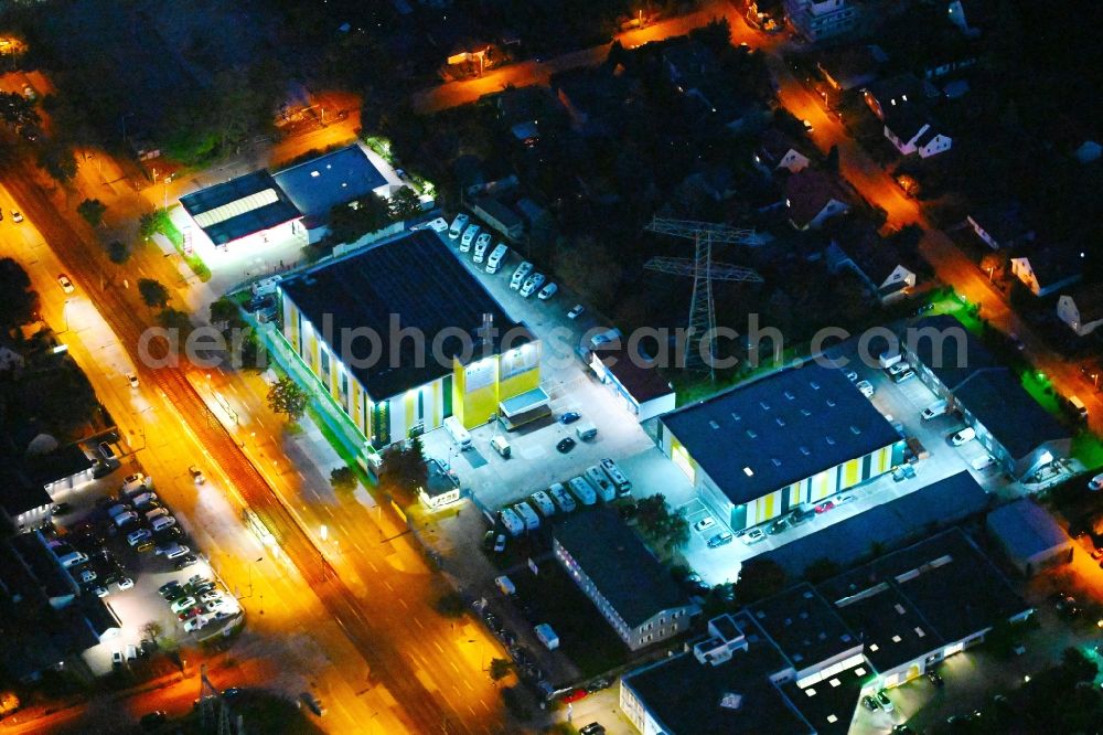 Berlin at night from the bird perspective: Night lighting storage house and self-storage warehouse on Hansastrasse in the district Hohenschoenhausen in Berlin, Germany