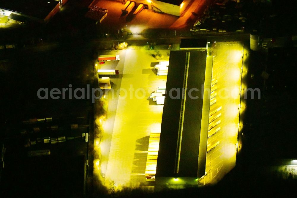 Aerial image at night Homberg (Efze) - Night lighting warehouses and forwarding building of CTL Cargo Trans Logistik AG in Homberg (Efze) in the state Hesse, Germany