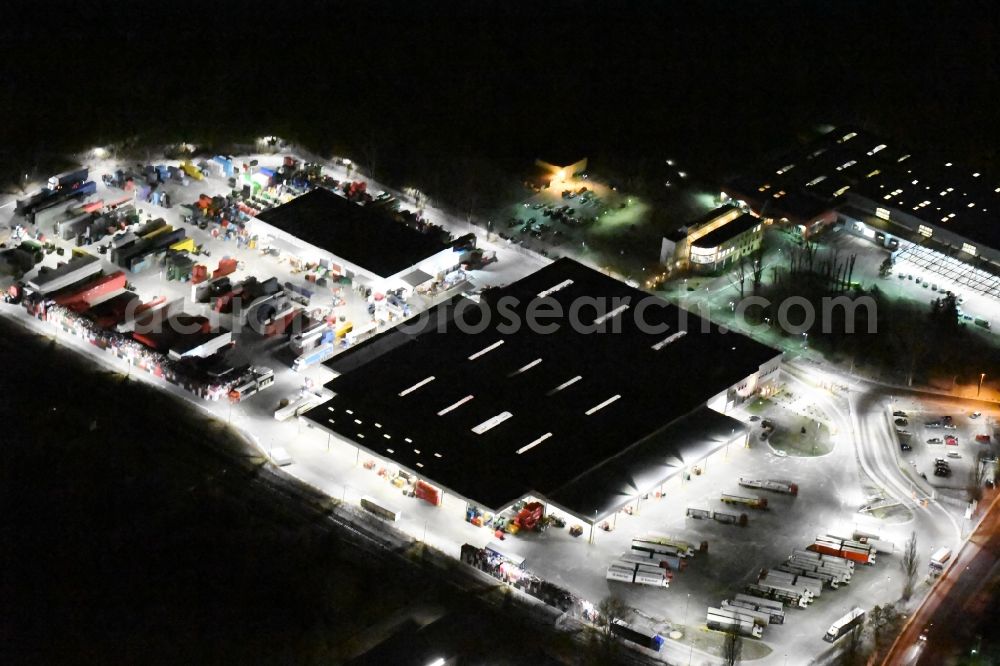 Potsdam at night from the bird perspective: Night view Warehouses and forwarding building Getraenke Essmann KG An der Brauerei in the district Potsdam Sued in Potsdam in the state Brandenburg