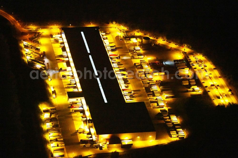 Aerial photograph at night Osnabrück - Night lighting Warehouses and forwarding building Heinrich Koch Internationale Spedition GmbH & Co. KG on Fuerstenauer Weg in Osnabrueck in the state Lower Saxony, Germany