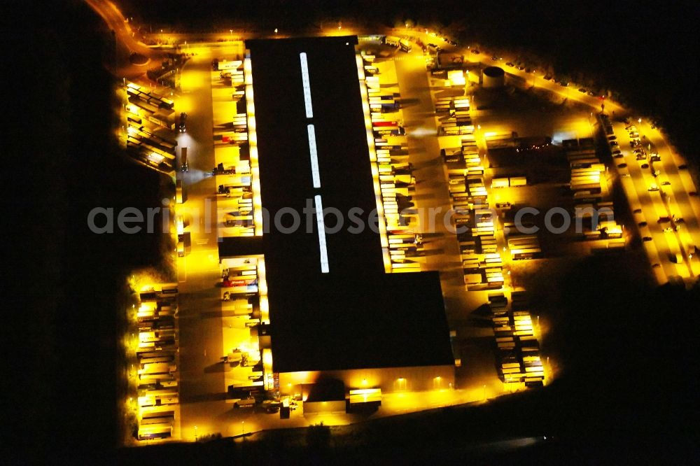 Aerial image at night Osnabrück - Night lighting Warehouses and forwarding building Heinrich Koch Internationale Spedition GmbH & Co. KG on Fuerstenauer Weg in Osnabrueck in the state Lower Saxony, Germany