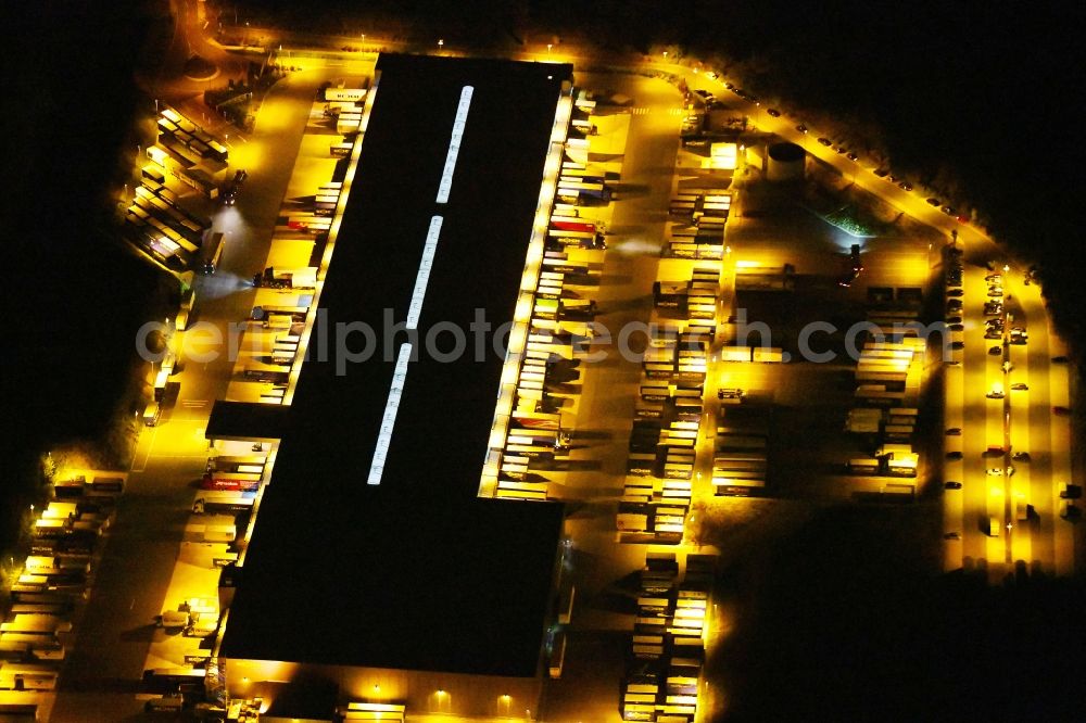 Osnabrück at night from above - Night lighting Warehouses and forwarding building Heinrich Koch Internationale Spedition GmbH & Co. KG on Fuerstenauer Weg in Osnabrueck in the state Lower Saxony, Germany