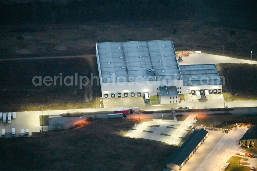 Aerial image at night Fahrbinde - Night lighting warehouses and forwarding building of Raben Trans European Germany in Fahrbinde in the state Mecklenburg - Western Pomerania, Germany