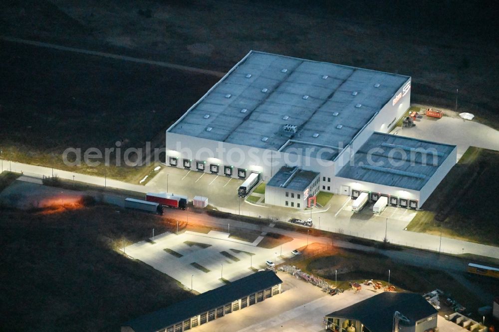 Fahrbinde at night from above - Night lighting warehouses and forwarding building of Raben Trans European Germany in Fahrbinde in the state Mecklenburg - Western Pomerania, Germany