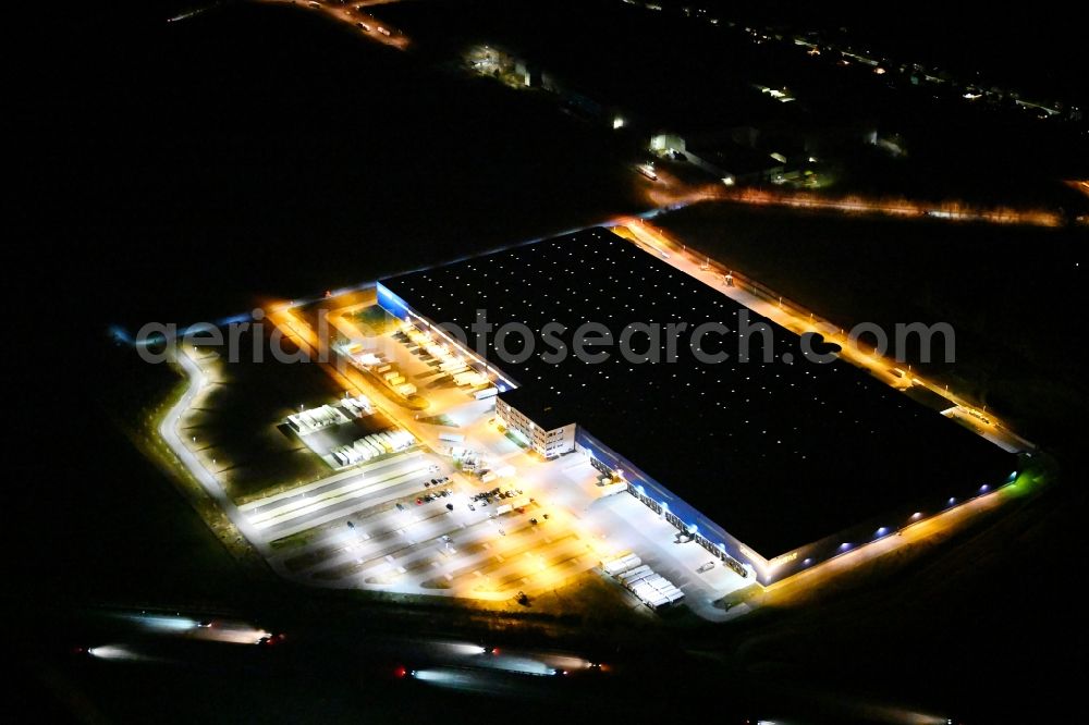 Aerial image at night Hörselgau - Night lighting warehouses and forwarding building of Rhenus SE & Co. KG in Hoerselgau in the state Thuringia, Germany