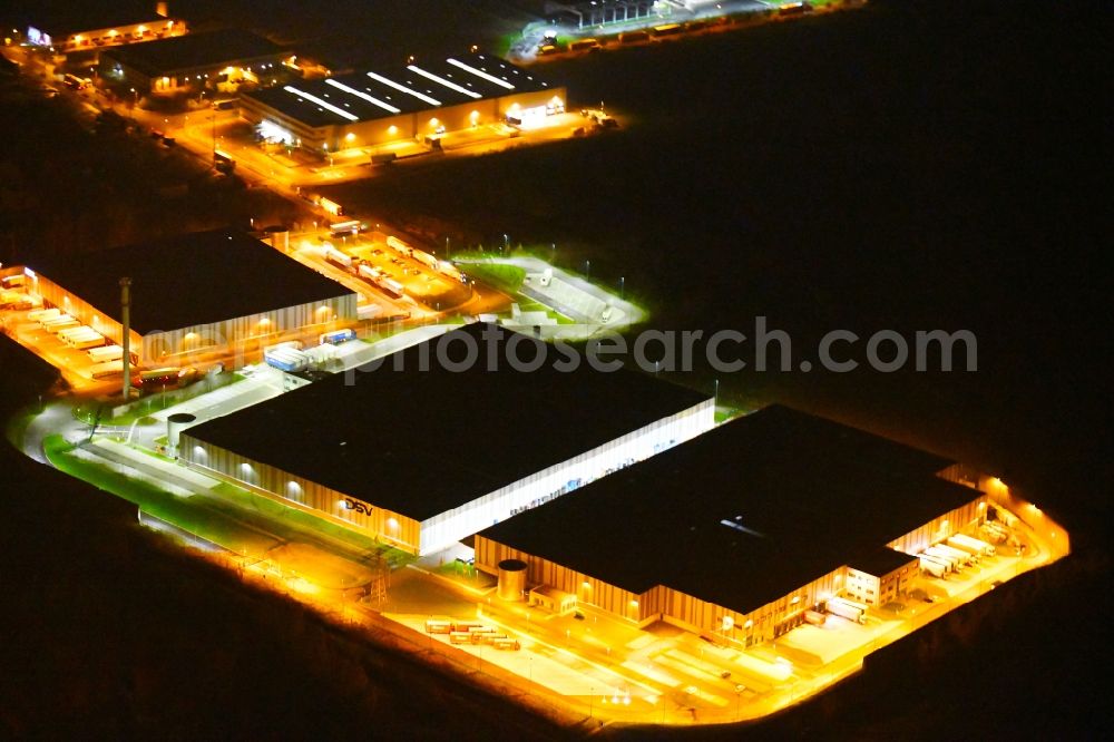 Aerial image at night Leipzig - Night lighting Warehouses and forwarding building of Schnellecke Modul- and Lieferantenzentrum GmbH Am Exer in the district Wahren in Leipzig in the state Saxony, Germany