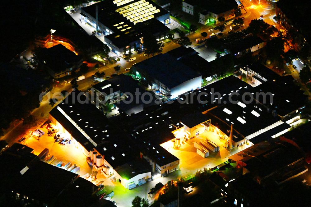 Berlin at night from above - Night lighting buildings and production halls on the food manufacturer's premises of Carl Kuehne KG on street Provinzstrasse - Kuehnemannstrasse in the district Reinickendorf in Berlin, Germany