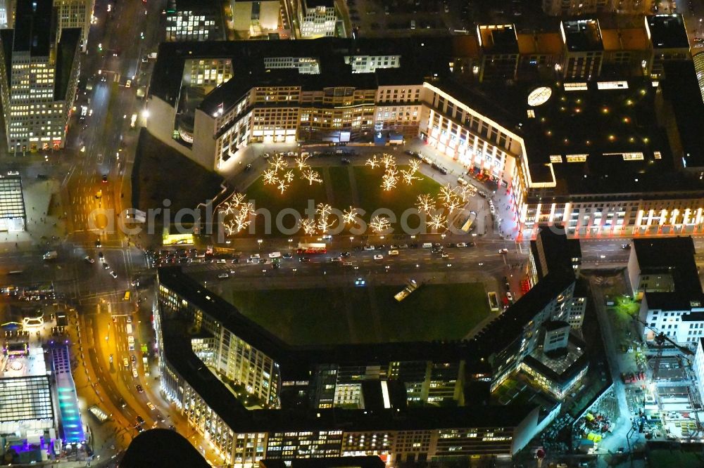 Aerial image at night Berlin - Night lighting Ensemble space Leipziger Platz in the inner city center in Berlin in Germany