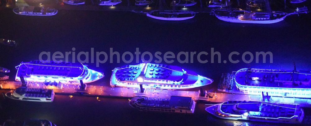 Aerial photograph at night Hamburg - Purple - pink night illumination of passenger ships in the harbor of Lower Elbe in the port area in Hamburg