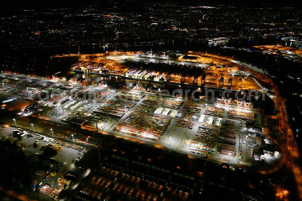 Aerial photograph at night Hamburg - Night lighting hHLA Logistics Container Terminal Burchardkai in the Port of Hamburg harbor in Hamburg in Germany