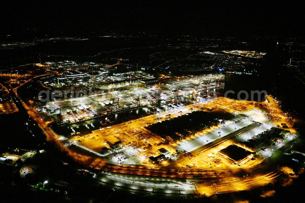 Aerial image at night Hamburg - Night lighting hHLA Logistics Container Terminal Burchardkai in the Port of Hamburg harbor in Hamburg in Germany