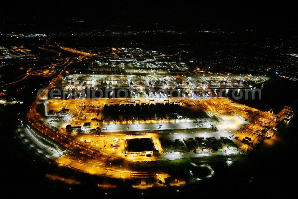 Hamburg at night from the bird perspective: Night lighting hHLA Logistics Container Terminal Burchardkai in the Port of Hamburg harbor in Hamburg in Germany