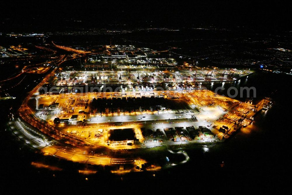 Aerial photograph at night Hamburg - Night lighting hHLA Logistics Container Terminal Burchardkai in the Port of Hamburg harbor in Hamburg in Germany