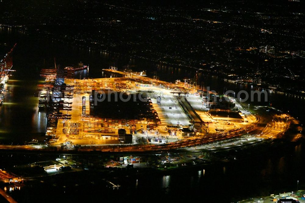 Aerial photograph at night Hamburg - Night lighting hHLA Logistics Container Terminal Burchardkai in the Port of Hamburg harbor in Hamburg in Germany