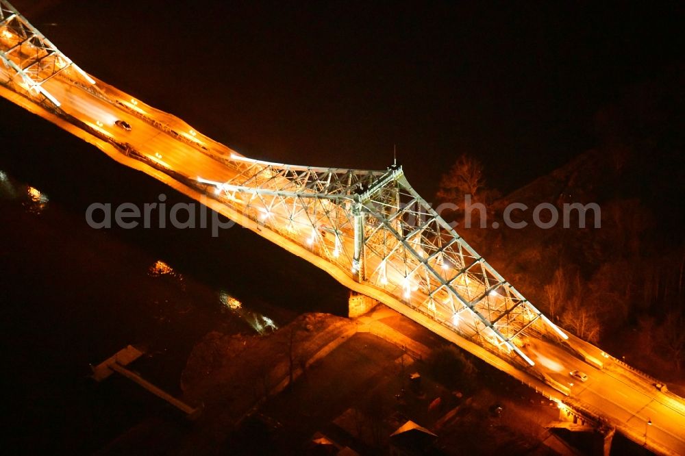 Aerial photograph at night Dresden - Night lighting the Loschwitzer bridge called Blue Miracle over the river Elbe in Dresden in the state Saxony. The bridge connects the districts Blasewitz and Loschwitz and is a well known landmark in Dresden