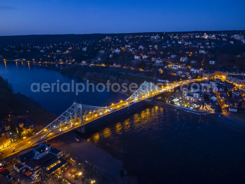 Aerial image at night Dresden - Night lighting the Loschwitzer bridge called Blue Miracle over the river Elbe in Dresden in the state Saxony. The bridge connects the districts Blasewitz and Loschwitz and is a well known landmark in Dresden