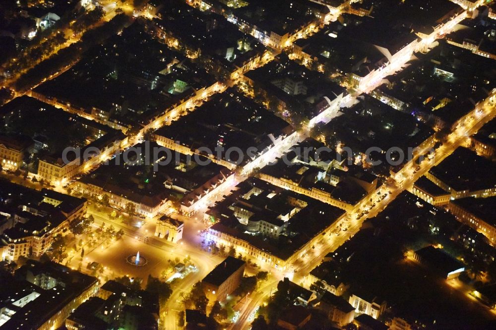 Aerial photograph at night Potsdam - Night view ensemble space Luisenplatz in the inner city center in Potsdam in the state Brandenburg. The square with the fountain and the Brandenburg Gate on the end of the Brandenburger Strasse