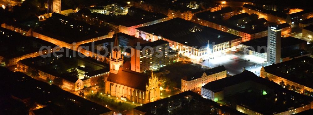 Aerial image at night Neubrandenburg - Night lighting Marketplace shopping center ECE Center in Neubrandenburg in Mecklenburg-Western Pomerania