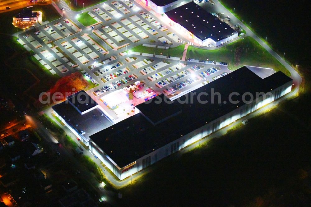 Berlin at night from above - Night lighting site for the new building home-center of the Porta-Group at Pilgramer street in the district Mahlsdorf in Berlin