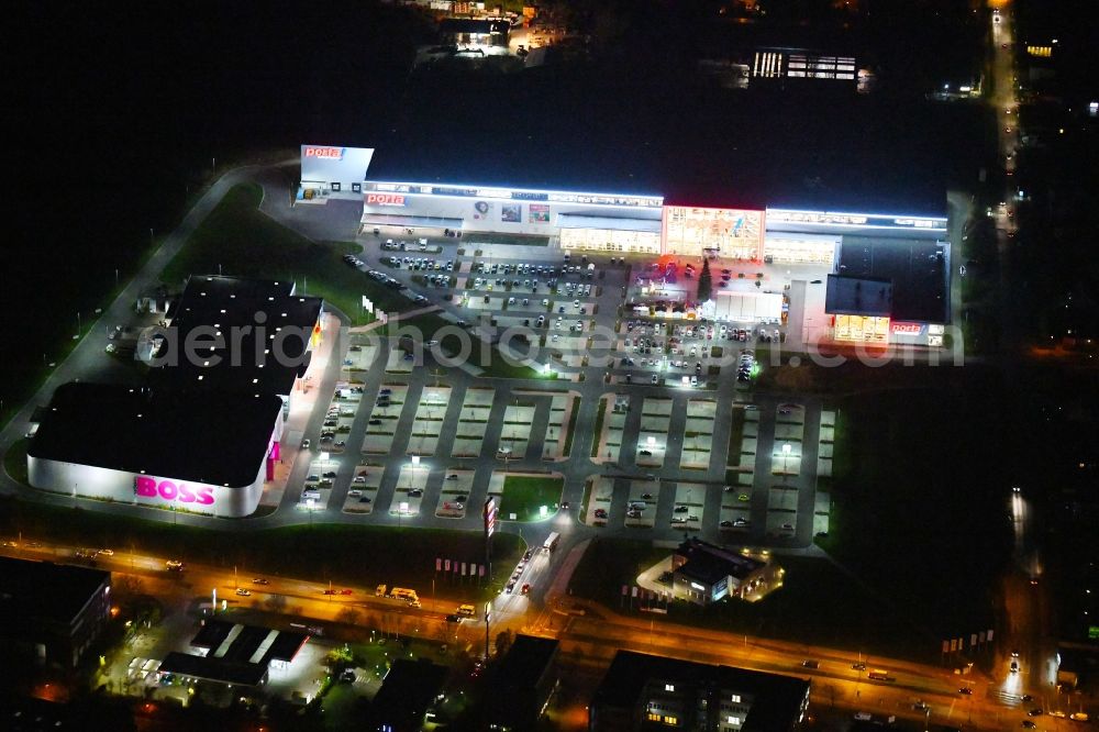 Berlin at night from above - Night lighting site for the new building home-center of the Porta-Group at Pilgramer street in the district Mahlsdorf in Berlin