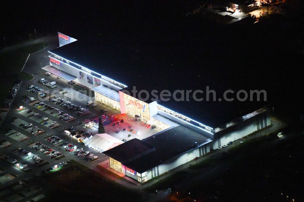 Berlin at night from above - Night lighting site for the new building home-center of the Porta-Group at Pilgramer street in the district Mahlsdorf in Berlin