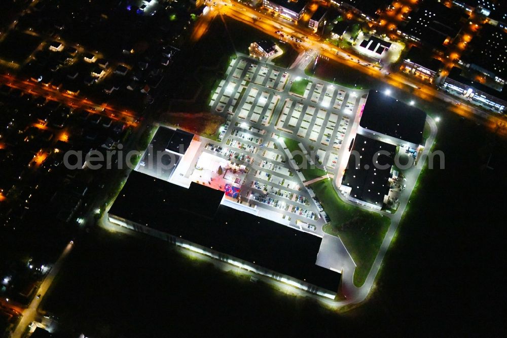 Berlin at night from above - Night lighting site for the new building home-center of the Porta-Group at Pilgramer street in the district Mahlsdorf in Berlin