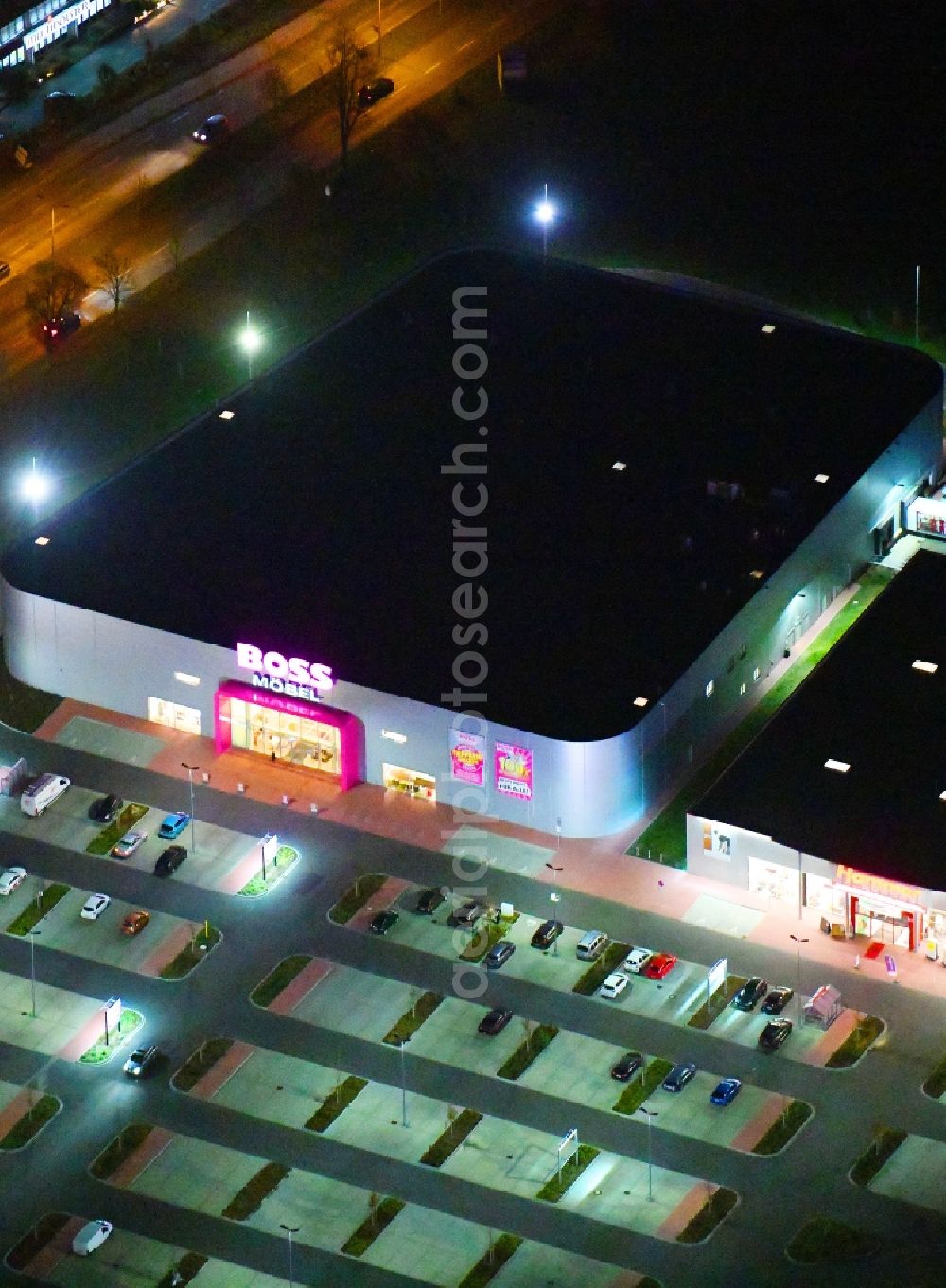 Aerial photograph at night Berlin - Night lighting site for the new building home-center of the Porta-Group at Pilgramer street in the district Mahlsdorf in Berlin