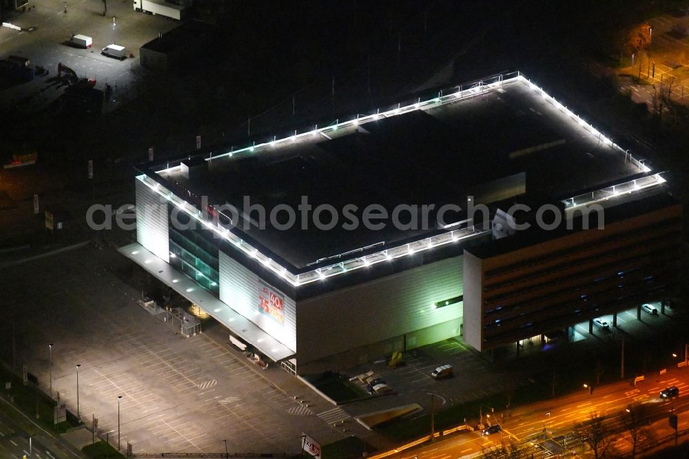 Aerial photograph at night Karlsruhe - Night lighting building of the store - furniture market XXL Lutz, MANN Management GmbH in the district Rintheim in Karlsruhe in the state Baden-Wurttemberg, Germany