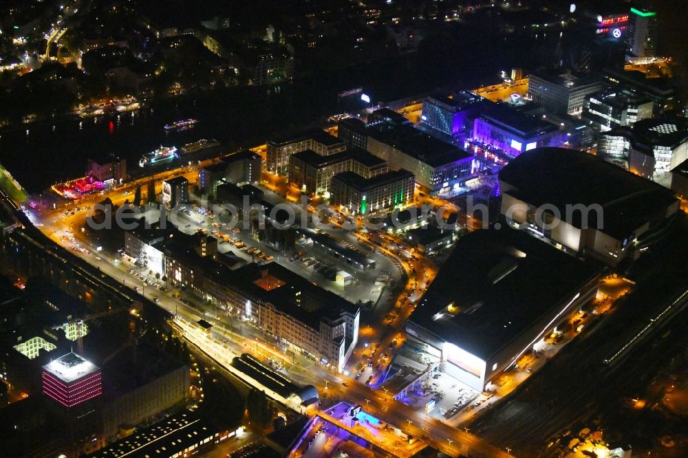 Berlin at night from above - Night lighting Arena Mercedes-Benz-Arena on Friedrichshain part of Berlin. The former O2 World - now Mercedes-Benz-Arena - is located in the Anschutz Areal, a business and office space on the riverbank