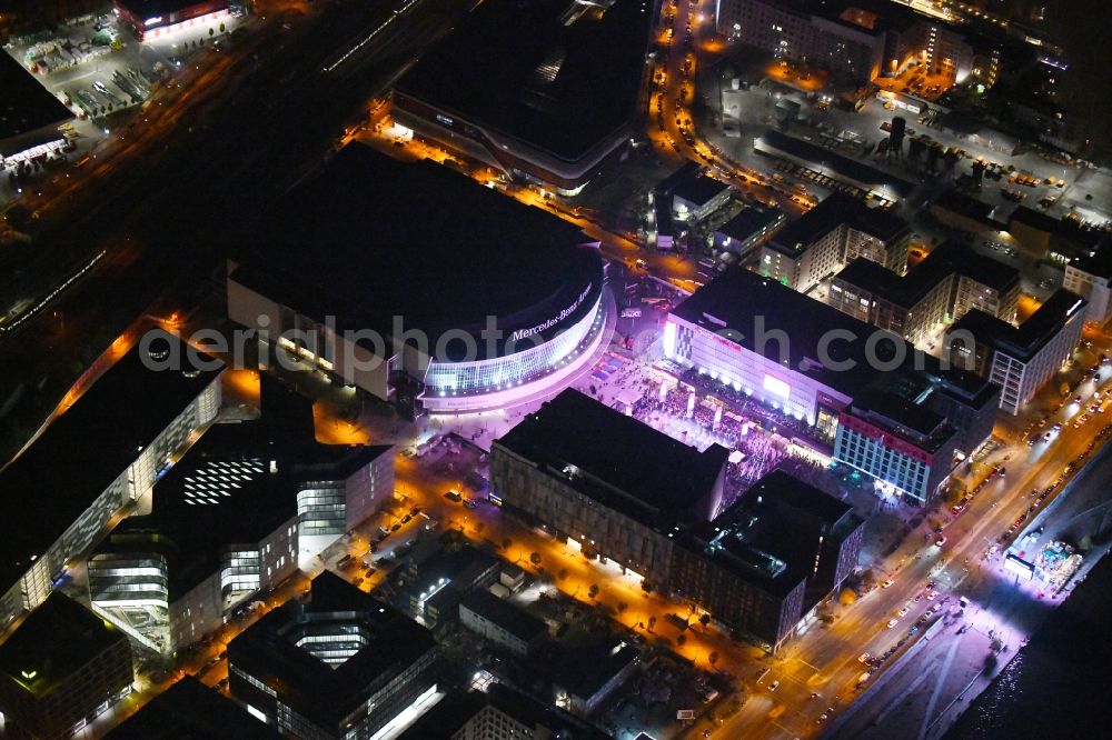 Berlin at night from above - Night lighting Arena Mercedes-Benz-Arena on Friedrichshain part of Berlin. The former O2 World - now Mercedes-Benz-Arena - is located in the Anschutz Areal, a business and office space on the riverbank