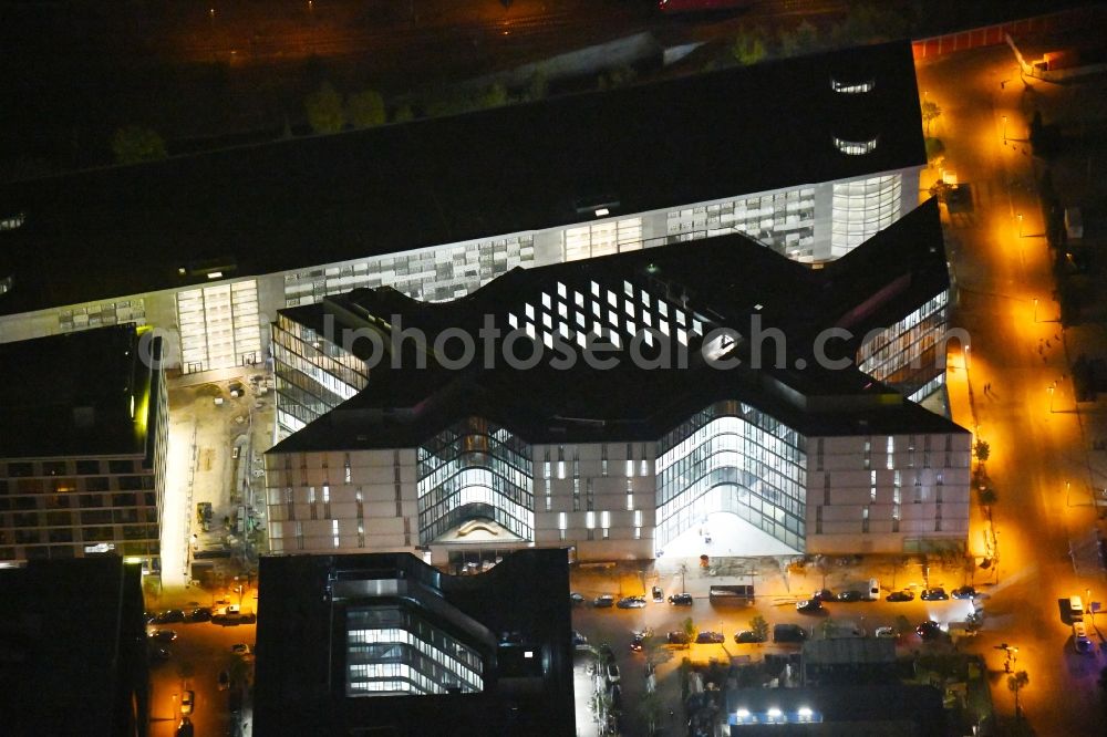 Berlin at night from above - Night lighting Arena Mercedes-Benz-Arena on Friedrichshain part of Berlin. The former O2 World - now Mercedes-Benz-Arena - is located in the Anschutz Areal, a business and office space on the riverbank