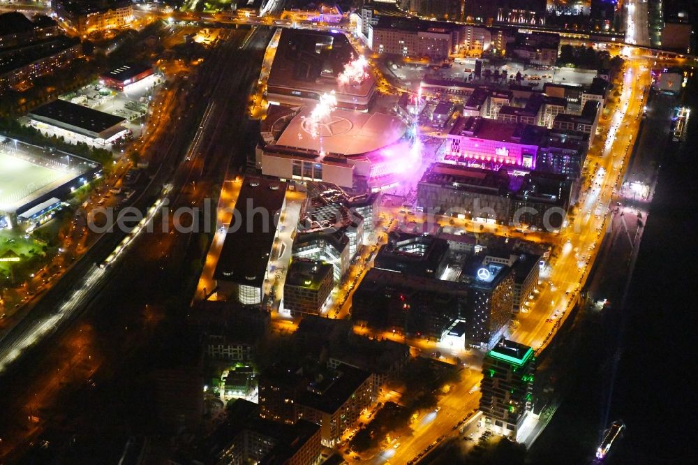 Berlin at night from above - Night lighting Arena Mercedes-Benz-Arena on Friedrichshain part of Berlin. The former O2 World - now Mercedes-Benz-Arena - is located in the Anschutz Areal, a business and office space on the riverbank