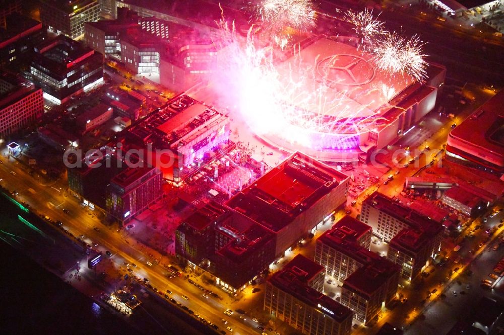 Berlin at night from above - Night lighting Arena Mercedes-Benz-Arena on Friedrichshain part of Berlin. The former O2 World - now Mercedes-Benz-Arena - is located in the Anschutz Areal, a business and office space on the riverbank