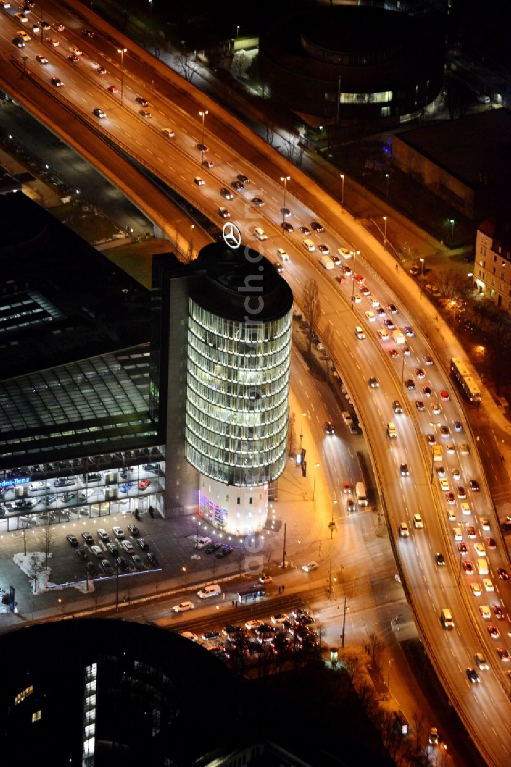 München at night from the bird perspective: Night lighting mercedes-Benz dealership in Munich at the Arnulf Strasse in Munich in Bavaria