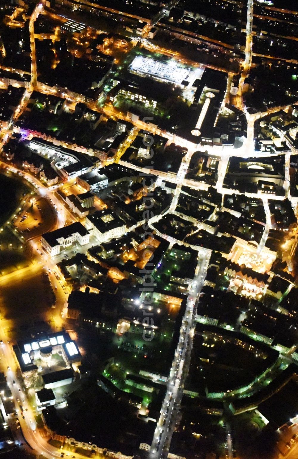 Schwerin at night from the bird perspective: Night view of the downtown area of Schwerin in the state Mecklenburg - Western Pomerania. In the picture as well the castle schwerin at the Burgsee