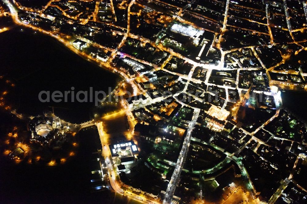 Aerial photograph at night Schwerin - Night view of the downtown area of Schwerin in the state Mecklenburg - Western Pomerania. In the picture as well the castle schwerin at the Burgsee