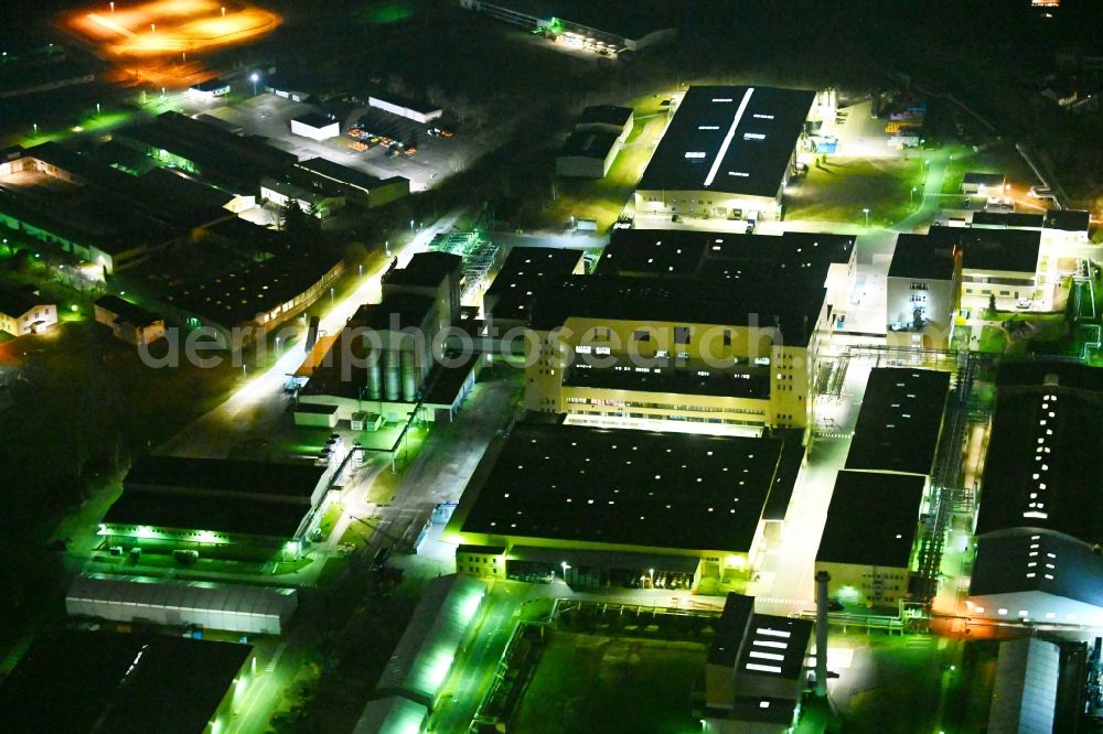 Waltershausen at night from above - Night lighting buildings and production halls on the vehicle construction of Multicar site in Waltershausen in the state Thuringia, Germany