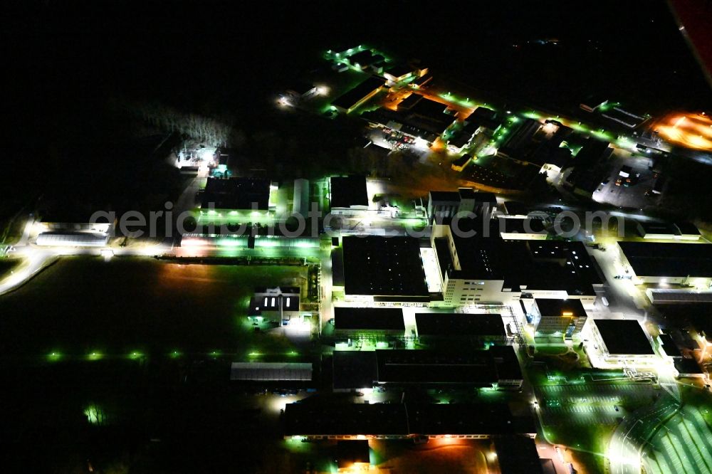 Waltershausen at night from above - Night lighting buildings and production halls on the vehicle construction of Multicar site in Waltershausen in the state Thuringia, Germany