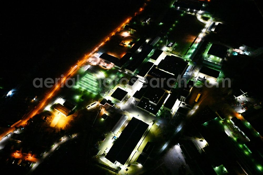 Aerial image at night Waltershausen - Night lighting buildings and production halls on the vehicle construction of Multicar site in Waltershausen in the state Thuringia, Germany