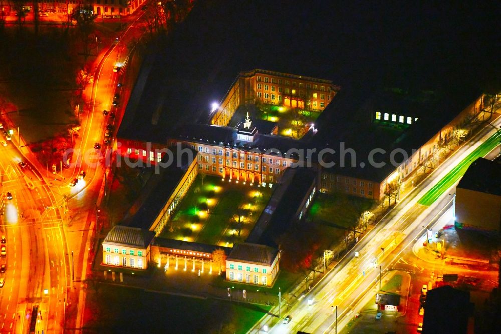 Aerial photograph at night Leipzig - Night lighting Museum building ensemble GRASSI Museum fuer Voelkerkande, Musikinstrumente and Angewondte Kunst on Johonnisplatz in Leipzig in the state Saxony, Germany